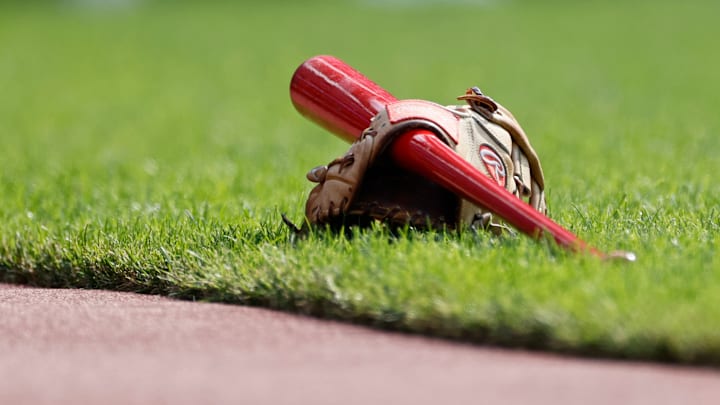 Cincinnati Reds bat and glove.