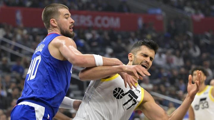 Apr 5, 2024; Los Angeles, California, USA; Utah Jazz center Omer Yurtseven (77) is fouled by Los