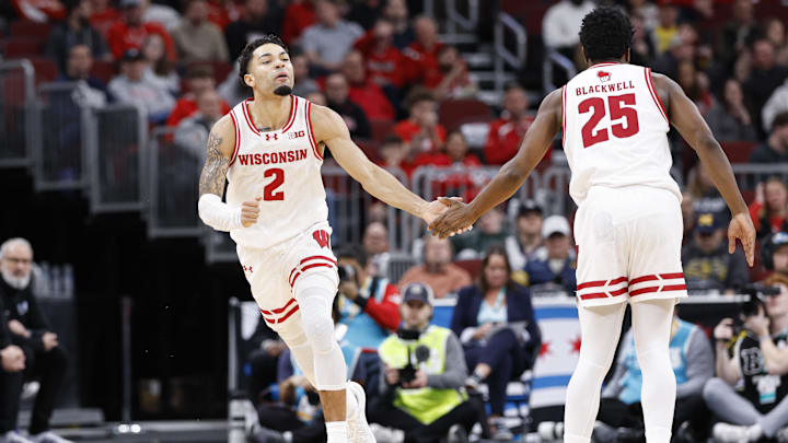 Mar 12, 2026; Chicago, IL, USA; Wisconsin Badgers guard Nick Boyd (2) reacts after scoring against the Washington Huskies during the first half at United Center. Mandatory Credit: Kamil Krzaczynski-Imagn Images
