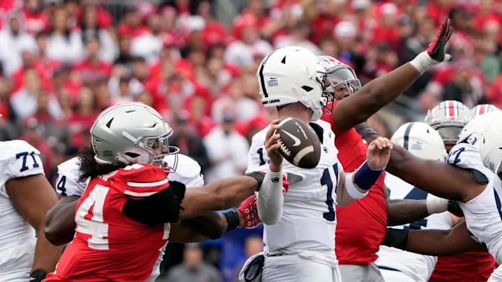 Oct 21, 2023; Columbus, Ohio, USA; Ohio State Buckeyes defensive end JT Tuimoloau (44) knocks the arm of Penn State Nittany Lions quarterback Drew Allar (15) as he tries to throw the ball on fourth down during the fourth quarter of their game at Ohio Stadium.