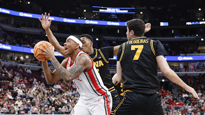 Mar 12, 2026; Chicago, IL, USA; Ohio State Buckeyes forward Amare Bynum (1) drives to the basket against Iowa Hawkeyes forward Alvaro Folgueiras (7) during the second half at United Center. Mandatory Credit: Kamil Krzaczynski-Imagn Images