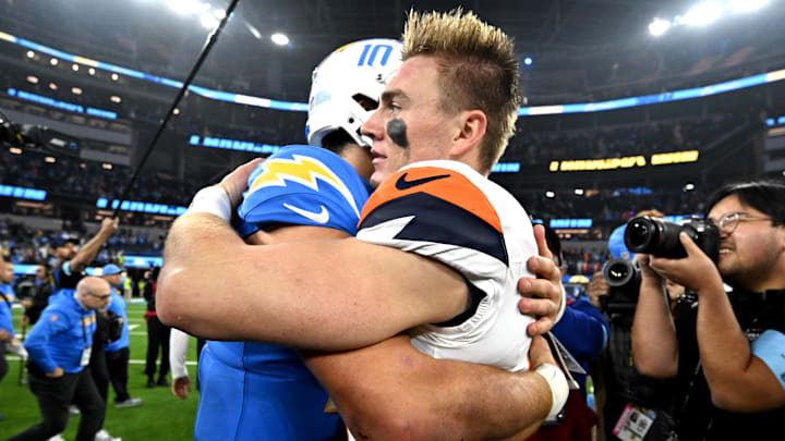 Dec 19, 2024; Inglewood, California, USA;  Los Angeles Chargers quarterback Justin Herbert (10) and Denver Broncos quarterback Bo Nix (10) embrace following the game at SoFi Stadium. Mandatory Credit: Jayne Kamin-Oncea-Imagn Images
