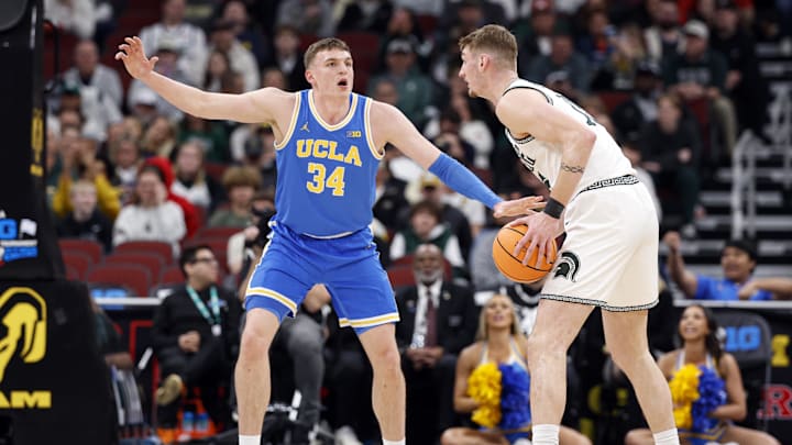 Mar 13, 2026; Chicago, IL, USA; UCLA Bruins forward Tyler Bilodeau (34) defends against Michigan State Spartans center Carson Cooper (15) during the first half at United Center. Mandatory Credit: Kamil Krzaczynski-Imagn Images