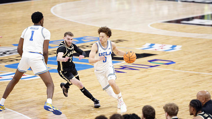 Mar 14, 2026; Chicago, IL, USA; UCLA Bruins guard Trent Perry (0) brings the ball up court against Purdue Boilermakers guard Braden Smith (3) during the first half at United Center. Mandatory Credit: Kamil Krzaczynski-Imagn Images