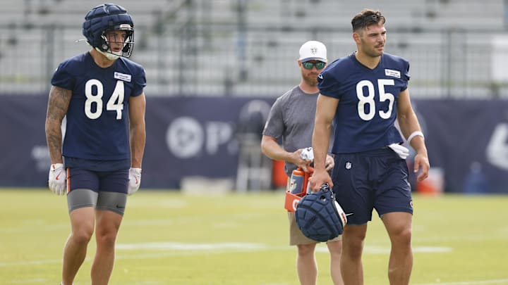 Jul 24, 2025; Lake Forest, IL, USA; Chicago Bears tight ends Colston Loveland (84) and Cole Kmet (85) stand on the field during training camp at Halas Hall.