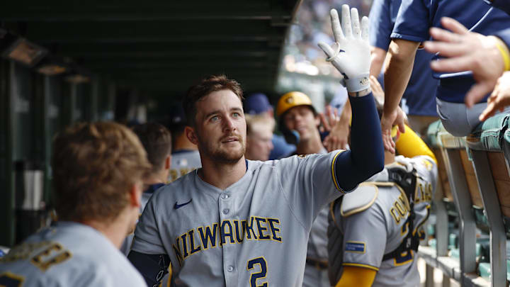 Aug 21, 2025; Chicago, Illinois, USA; Milwaukee Brewers second baseman Brice Turang (2) celebrates with teammates in the dugout after hitting a two-run home run against the Chicago Cubs during the second inning at Wrigley Field. Mandatory Credit: Kamil Krzaczynski-Imagn Images