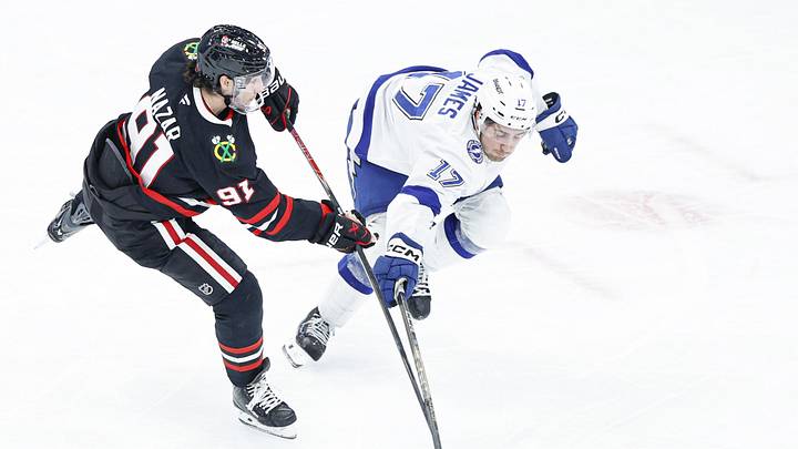 Jan 23, 2026; Chicago, Illinois, USA; Tampa Bay Lightning center Dominic James (17) defends against Chicago Blackhawks center Frank Nazar (91) during the second period at United Center. Mandatory Credit: Kamil Krzaczynski-Imagn Images