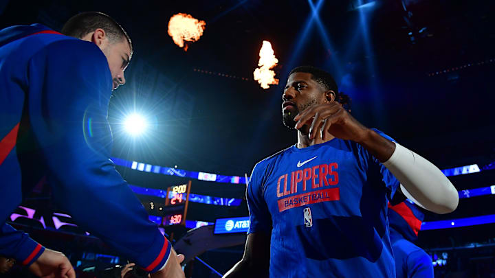 Oct 23, 2022; Los Angeles, California, USA; Los Angeles Clippers guard Paul George (13) is greeted by center Ivica Zubac (40) before playing against the Phoenix Suns at Crypto.com Arena. Mandatory Credit: Gary A. Vasquez-Imagn Images
