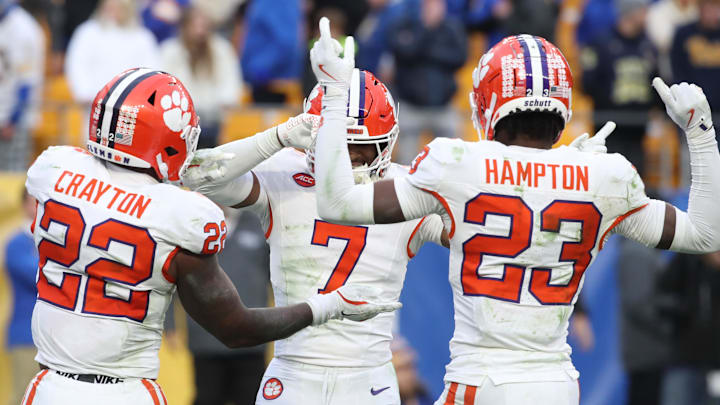 Nov 16, 2024; Pittsburgh, Pennsylvania, USA; Clemson Tigers safety Khalil Barnes (7) celebrates his game clinching interception as time ran out with linebacker Dee Crayton (22) and cornerback Ashton Hampton (23) against the Pittsburgh Panthers during the fourth quarter at Acrisure Stadium. Mandatory Credit: Charles LeClaire-Imagn Images Nov 16, 2024; Pittsburgh, Pennsylvania, USA; Clemson Tigers safety Khalil Barnes (7) celebrates his game clinching interception as time ran out with linebacker Dee Crayton (22) and cornerback Ashton Hampton (23) against the Pittsburgh Panthers during the fourth quarter at Acrisure Stadium. Mandatory Credit: Charles LeClaire-Imagn Images