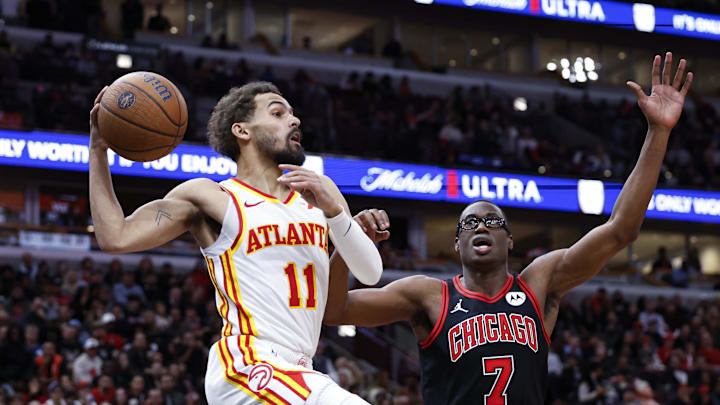 Nov 22, 2024; Chicago, Illinois, USA; Atlanta Hawks guard Trae Young (11) looks to pass the ball against Chicago Bulls forward Jalen Smith (7) during the second half at United Center. Mandatory Credit: Kamil Krzaczynski-Imagn Images
