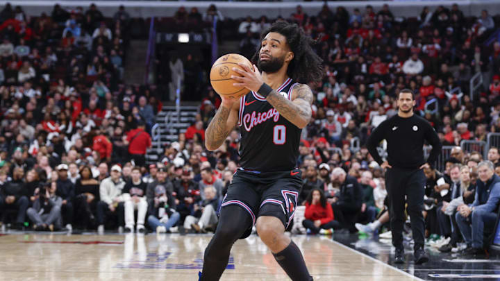Chicago Bulls guard Coby White (0) shoots against the Boston Celtics 