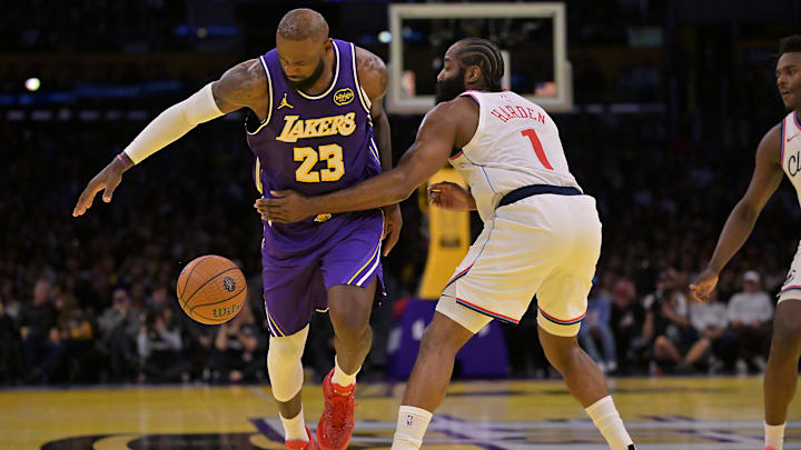Nov 25, 2025; Los Angeles, California, USA; Los Angeles Lakers forward LeBron James (23) is fouled by Los Angeles Clippers guard James Harden (1) during the first half at Crypto.com Arena. Mandatory Credit: Jayne Kamin-Oncea-Imagn Images