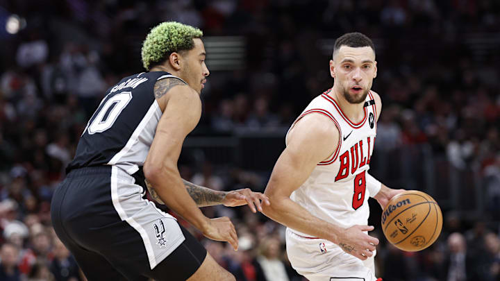 Jan 6, 2025; Chicago, Illinois, USA; Chicago Bulls guard Zach LaVine (8) drives to the basket against San Antonio Spurs forward Jeremy Sochan (10) during the second half at United Center. Mandatory Credit: Kamil Krzaczynski-Imagn Images