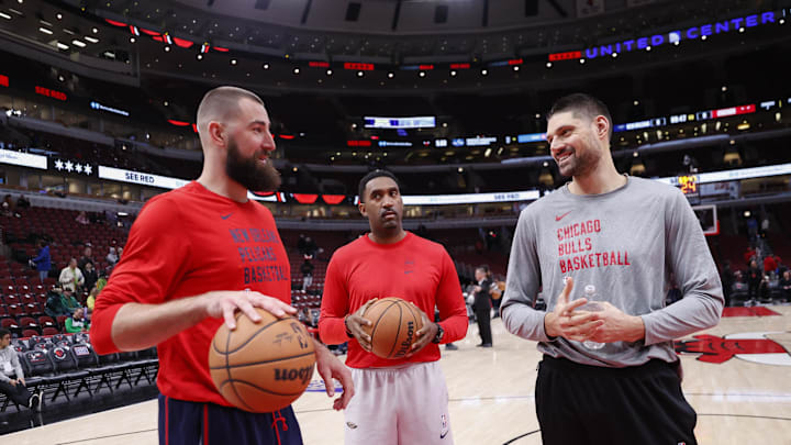 Dec 2, 2023; Chicago, Illinois, USA; New Orleans Pelicans center Jonas Valanciunas (L) chats with Chicago Bulls center Nikola Vucevic (R) before a basketball game at United Center. Mandatory Credit: Kamil Krzaczynski-Imagn Images
