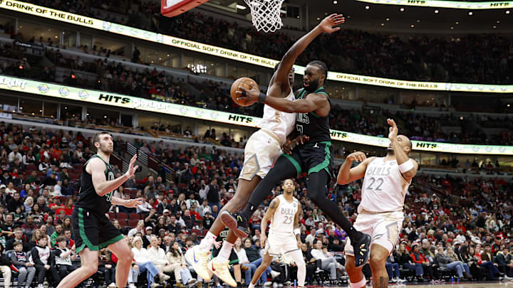 Dec 21, 2024; Chicago, Illinois, USA; Boston Celtics guard Jaylen Brown (7) passes the ball against Chicago Bulls forward Jalen Smith (7) during the second half at United Center. Mandatory Credit: Kamil Krzaczynski-Imagn Images