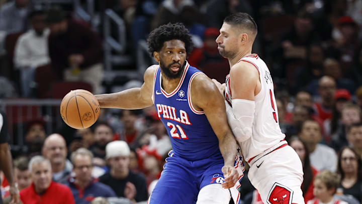 Dec 8, 2024; Chicago, Illinois, USA; Chicago Bulls center Nikola Vucevic (9) defends against Philadelphia 76ers center Joel Embiid (21) during the first half at United Center. Mandatory Credit: Kamil Krzaczynski-Imagn Images Dec 8, 2024; Chicago, Illinois, USA; Chicago Bulls center Nikola Vucevic (9) defends against Philadelphia 76ers center Joel Embiid (21) during the first half at United Center. Mandatory Credit: Kamil Krzaczynski-Imagn Images