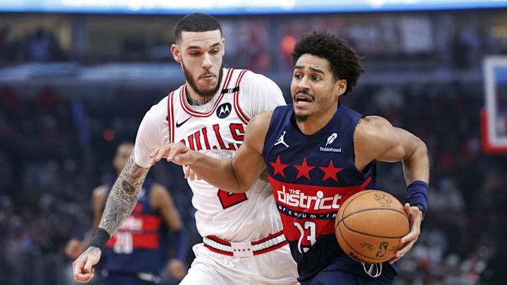 Jan 10, 2025; Chicago, Illinois, USA; Washington Wizards guard Jordan Poole (13) drives to the basket against Chicago Bulls guard Lonzo Ball (2) during the second half at United Center. Mandatory Credit: Kamil Krzaczynski-Imagn Images
