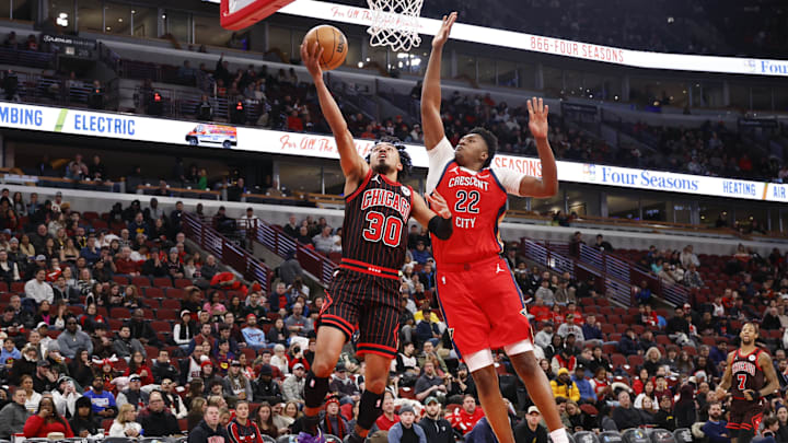 Dec 14, 2025; Chicago, Illinois, USA; Chicago Bulls guard Tre Jones (30) goes to the basket against New Orleans Pelicans center Derik Queen (22) during the first half at United Center. Mandatory Credit: Kamil Krzaczynski-Imagn Images Dec 14, 2025; Chicago, Illinois, USA; Chicago Bulls guard Tre Jones (30) goes to the basket against New Orleans Pelicans center Derik Queen (22) during the first half at United Center. Mandatory Credit: Kamil Krzaczynski-Imagn Images