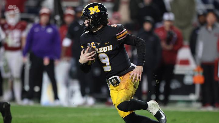 Nov 29, 2025; Fayetteville, Arkansas, USA; Missouri Tigers quarterback Beau Pribula (9) rushes during the third quarter against the Arkansas Razorbacks at Donald W. Reynolds Razorback Stadium. Missouri won 31-17. Mandatory Credit: Nelson Chenault-Imagn Images Nov 29, 2025; Fayetteville, Arkansas, USA; Missouri Tigers quarterback Beau Pribula (9) rushes during the third quarter against the Arkansas Razorbacks at Donald W. Reynolds Razorback Stadium. Missouri won 31-17. Mandatory Credit: Nelson Chenault-Imagn Images