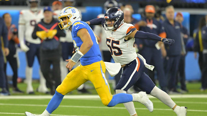 Chargers quarterback Justin Herbert (10) is brought down by Broncos linebacker Cody Barton (55) in 2024 Chargers quarterback Justin Herbert (10) is brought down by Broncos linebacker Cody Barton (55) in 2024