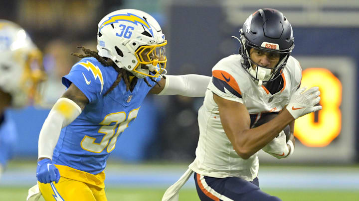Denver Broncos wide receiver Devaughn Vele (17) is stopped by Los Angeles Chargers cornerback Ja'Sir Taylor (36) after a complete pass in the first half at SoFi Stadium. Denver Broncos wide receiver Devaughn Vele (17) is stopped by Los Angeles Chargers cornerback Ja'Sir Taylor (36) after a complete pass in the first half at SoFi Stadium.