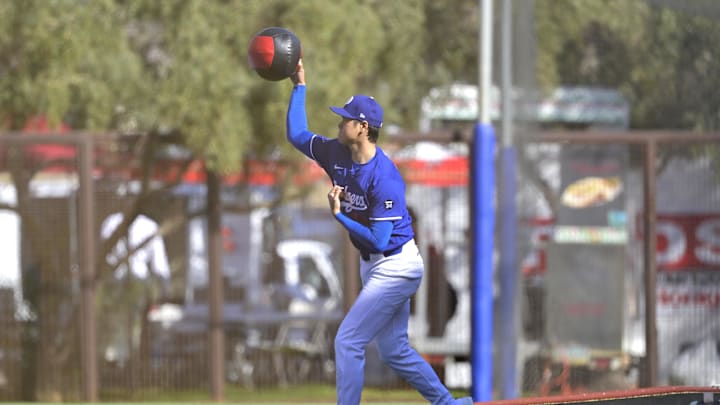Los Angeles Dodgers two-way player Shohei Ohtani (17) warms up prior to throwing a bullpen session during spring training workouts at Camelback Ranch in 2025.