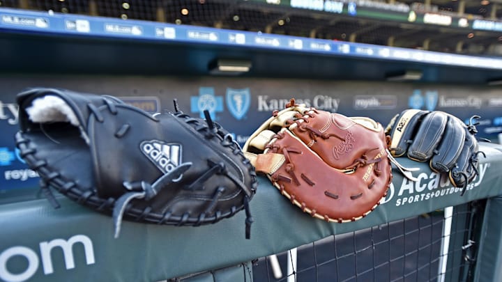 Sep 15, 2016; Kansas City, MO, USA;  A general view of baseball gloves on the railing of the dugout prior to the game between the Oakland Athletics and the Kansas City Royals at Kauffman Stadium. Mandatory Credit: Peter G. Aiken-Imagn Images