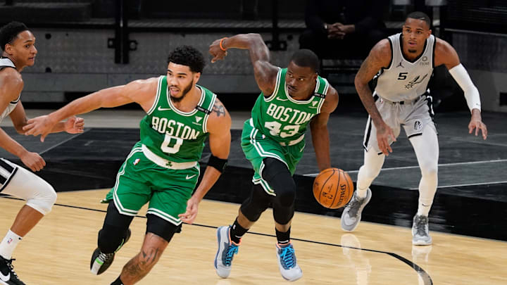 Jan 27, 2021; San Antonio, Texas, USA; Boston Celtics guard Javonte Green (43) brings ball up court as Celtics forward Jayson Tatum (0) and San Antonio Spurs guard Dejounte Murray (5) look on in the second quarter at AT&T Center. Mandatory Credit: Scott Wachter-Imagn Images