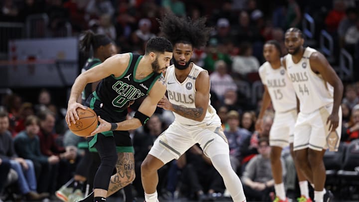 Dec 21, 2024; Chicago, Illinois, USA; Chicago Bulls guard Coby White (0) defends against Boston Celtics forward Jayson Tatum (0) during the first half at United Center. Mandatory Credit: Kamil Krzaczynski-Imagn Images