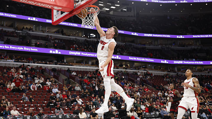 Nov 21, 2025; Chicago, Illinois, USA; Miami Heat guard Pelle Larsson (9) scores against the Chicago Bulls during the second half at United Center. Mandatory Credit: Kamil Krzaczynski-Imagn Images