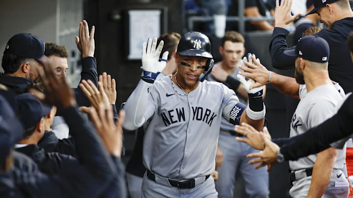 Aug 30, 2025; Chicago, Illinois, USA; New York Yankees designated hitter Aaron Judge (99) celebrates with teammates in the dugout after hitting a solo home run against the Chicago White Sox during the fourth inning at Rate Field. Mandatory Credit: Kamil Krzaczynski-Imagn Images Aug 30, 2025; Chicago, Illinois, USA; New York Yankees designated hitter Aaron Judge (99) celebrates with teammates in the dugout after hitting a solo home run against the Chicago White Sox during the fourth inning at Rate Field. Mandatory Credit: Kamil Krzaczynski-Imagn Images