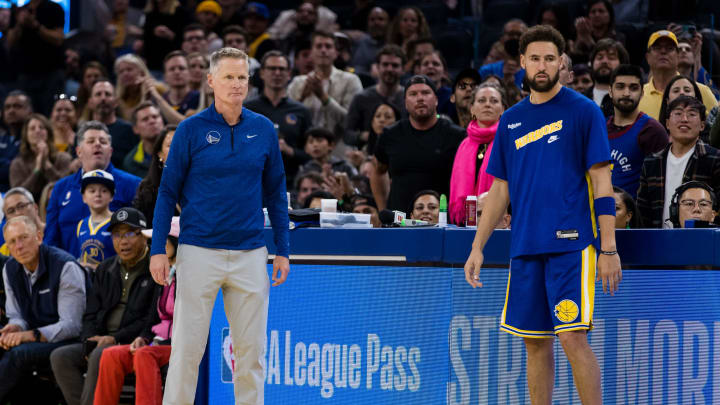 Oct 21, 2022; San Francisco, California, USA; Golden State Warriors head coach Steve Kerr and guard Klay Thompson (11) watch during the second half of the game against the Denver Nuggets at Chase Center. Mandatory Credit: John Hefti-USA TODAY Sports Oct 21, 2022; San Francisco, California, USA; Golden State Warriors head coach Steve Kerr and guard Klay Thompson (11) watch during the second half of the game against the Denver Nuggets at Chase Center. Mandatory Credit: John Hefti-USA TODAY Sports