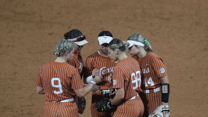 May 9, 2025; Athens, GA, USA; Texas teammates meet on the mound during a game against Texas A&M at Jack Turner Stadium. Mandatory Credit: Mady Mertens-Imagn Images