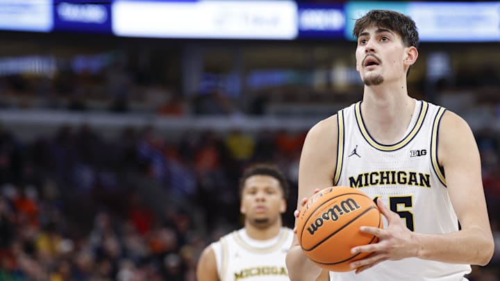 Mar 13, 2026; Chicago, IL, USA; Michigan Wolverines center Aday Mara (15) shoots a free throw against the Ohio State Buckeyes during the second half at United Center. Mandatory Credit: Kamil Krzaczynski-Imagn Images
