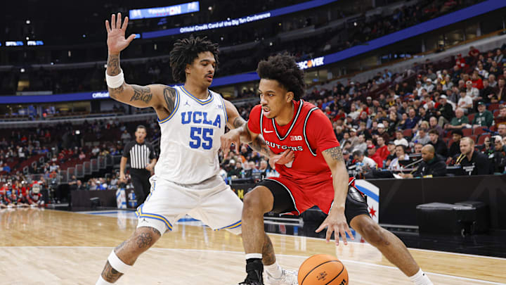 Mar 12, 2026; Chicago, IL, USA; Rutgers Scarlet Knights guard Tariq Francis (0) drives to the basket against UCLA Bruins guard Skyy Clark (55) during the first half at United Center. Mandatory Credit: Kamil Krzaczynski-Imagn Images Mar 12, 2026; Chicago, IL, USA; Rutgers Scarlet Knights guard Tariq Francis (0) drives to the basket against UCLA Bruins guard Skyy Clark (55) during the first half at United Center. Mandatory Credit: Kamil Krzaczynski-Imagn Images