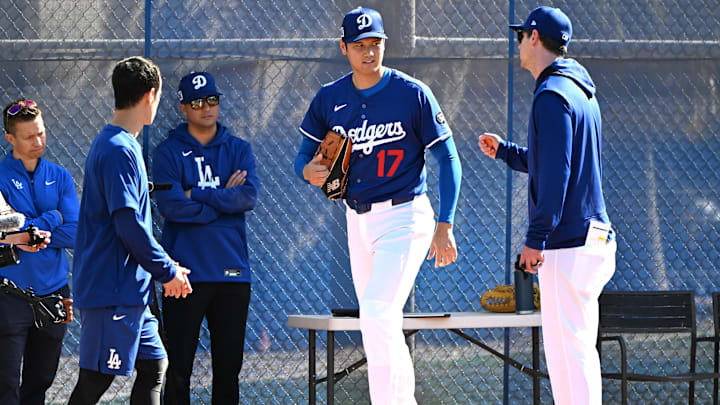 Feb 18, 2025; Glendale, AZ, USA; Los Angeles Dodgers designated hitter Shohei Ohtani (17) works with Los Angeles Dodgers assistant pitching coach Connor McGuiness (87) during a spring training bullpen session at Camelback Ranch. Mandatory Credit: Jayne Kamin-Oncea-Imagn Images Feb 18, 2025; Glendale, AZ, USA; Los Angeles Dodgers designated hitter Shohei Ohtani (17) works with Los Angeles Dodgers assistant pitching coach Connor McGuiness (87) during a spring training bullpen session at Camelback Ranch. Mandatory Credit: Jayne Kamin-Oncea-Imagn Images
