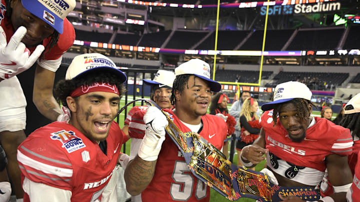 The UNLV Rebels celebrate after defeating the California Golden Bears in the LA Bowl at SoFi Stadium. The UNLV Rebels celebrate after defeating the California Golden Bears in the LA Bowl at SoFi Stadium.