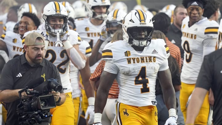 Sep 16, 2023; Austin, Texas, USA; Wyoming Cowboys running back Harrison Waylee (4) reacts after scoring a touchdown in the first half against the Texas Longhorns at Darrell K Royal-Texas Memorial Stadium. Mandatory Credit: Scott Wachter-USA TODAY Sports Sep 16, 2023; Austin, Texas, USA; Wyoming Cowboys running back Harrison Waylee (4) reacts after scoring a touchdown in the first half against the Texas Longhorns at Darrell K Royal-Texas Memorial Stadium. Mandatory Credit: Scott Wachter-USA TODAY Sports