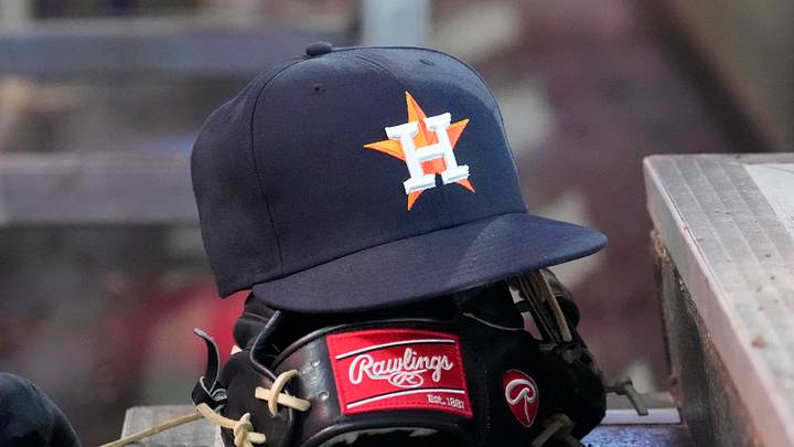 Houston Astros ball cap and glove. Credit Houston Astros ball cap and glove. Credit