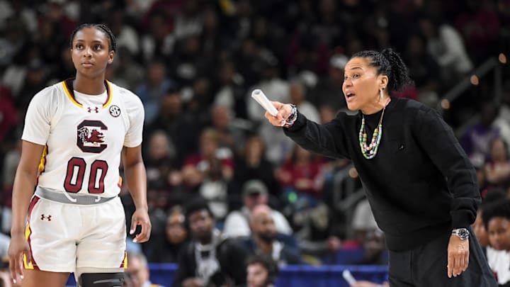 South Carolina Gamecocks guard Ta'niya Latson (00) talks to South Carolina Gamecocks head coach Dawn Staley Sunday, March 8, 2026, during the SEC Women's Basketball Tournament Championship game against the Texas Longhorns at Bon Secours Wellness Arena in Greenville, South Carolina. South Carolina Gamecocks guard Ta'niya Latson (00) talks to South Carolina Gamecocks head coach Dawn Staley Sunday, March 8, 2026, during the SEC Women's Basketball Tournament Championship game against the Texas Longhorns at Bon Secours Wellness Arena in Greenville, South Carolina.