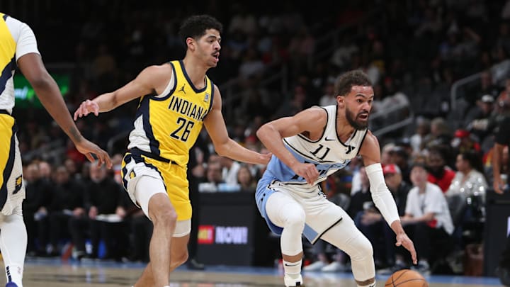 Mar 8, 2025; Atlanta, Georgia, USA; Atlanta Hawks guard Trae Young (11) dribbles against Indiana Pacers guard Ben Sheppard (26) during the first quarter at State Farm Arena. Mandatory Credit: Mady Mertens-Imagn Images