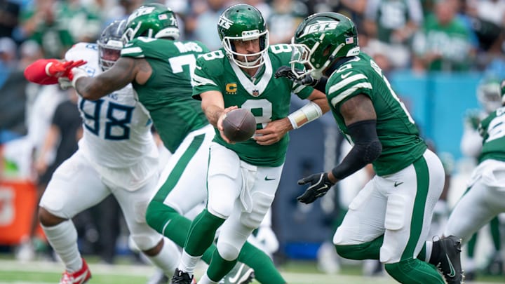 New York Jets quarterback Aaron Rodgers (8) hands off to running back Braelon Allen (0) in the third quarter of their game against the Tennessee Titans at Nissan Stadium in Nashville, Tenn., Sunday, Sept. 15, 2024.
