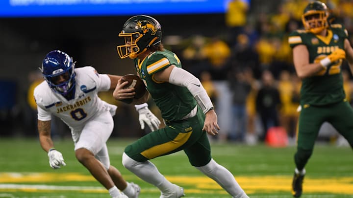 North Dakota State Bison quarterback Cam Miller (7) rushes the ball on Saturday, Dec. 21, 2024, at Fargodome in Fargo, North Dakota.
