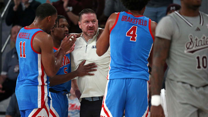 Feb 21, 2024; Starkville, Mississippi, USA; Mississippi Rebels head coach Chris Beard is held back by guard Matthew Murrell (11) and guard Jaylen Murray (5) after a technical foul during the second half against the Mississippi State Bulldogs at Humphrey Coliseum. Mandatory Credit: Petre Thomas-Imagn Images Feb 21, 2024; Starkville, Mississippi, USA; Mississippi Rebels head coach Chris Beard is held back by guard Matthew Murrell (11) and guard Jaylen Murray (5) after a technical foul during the second half against the Mississippi State Bulldogs at Humphrey Coliseum. Mandatory Credit: Petre Thomas-Imagn Images
