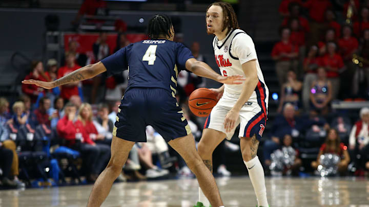 Nov 21, 2024; Oxford, Mississippi, USA; Mississippi Rebels guard Robert Cowherd (6) dribbles as Oral Roberts Golden Eagles forward Jackson Skipper (4) defends during the second half at The Sandy and John Black Pavilion at Ole Miss. Mandatory Credit: Petre Thomas-Imagn Images
