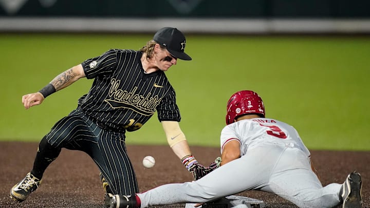 Arkansas second baseman Nolan Souza (3) steals second base under Vanderbilt shortstop Jonathan Vastine (13) during the seventh inning at Hawkins Field in Nashville, Tenn., Friday, March 28, 2025.