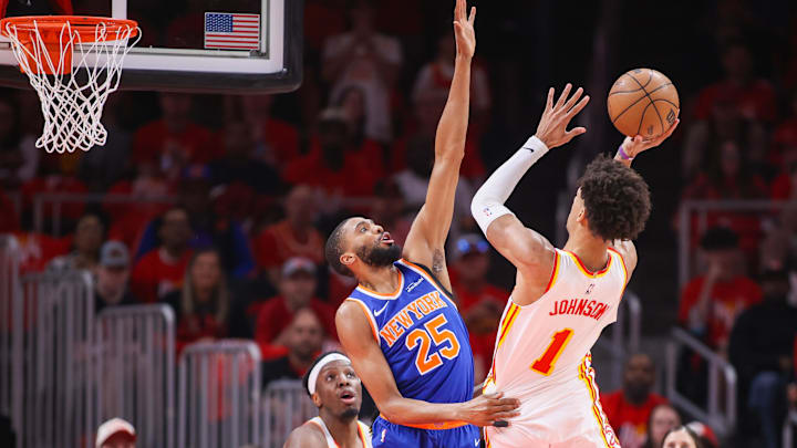 Apr 23, 2026; Atlanta, Georgia, USA; New York Knicks guard Mikal Bridges (25) defends the shot of Atlanta Hawks forward Jalen Johnson (1) in the first quarter during game three of the first round of the 2026 NBA Playoffs at State Farm Arena. Mandatory Credit: Brett Davis-Imagn Images