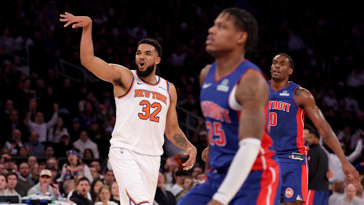 Jan 13, 2025; New York, New York, USA; New York Knicks center Karl-Anthony Towns (32) reacts after missing a three point shot against Detroit Pistons guard Marcus Sasser (25) and center Jalen Duren (0) during the second quarter at Madison Square Garden. Mandatory Credit: Brad Penner-Imagn Images