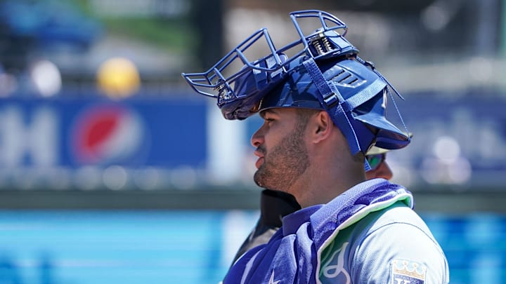 Kansas City Royals catcher Sebastian Rivero (48) greets an umpire prior to the game against the Minnesota Twins at Kauffman Stadium on May 22, 2022.