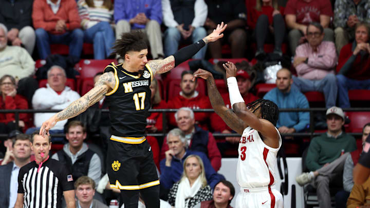 Jan 27, 2026; Tuscaloosa, Alabama, USA; Missouri Tigers guard Jayden Stone (17) attempts to block Alabama Crimson Tide guard Latrell Wrightsell Jr. (3) during the first half at Coleman Coliseum. Mandatory Credit: David Leong-Imagn Images